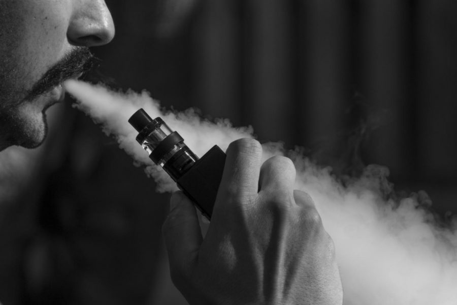 A photograph of a man and his vape. Photo Courtesy of: Pixabay
