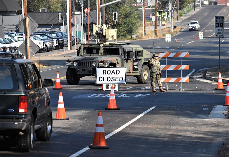 California National Guard closes down roads in Healdsburg, California. Evacuation orders were given to multiple towns nearby the Kincade Fire. Photo courtesy of: Wikimedia Commons