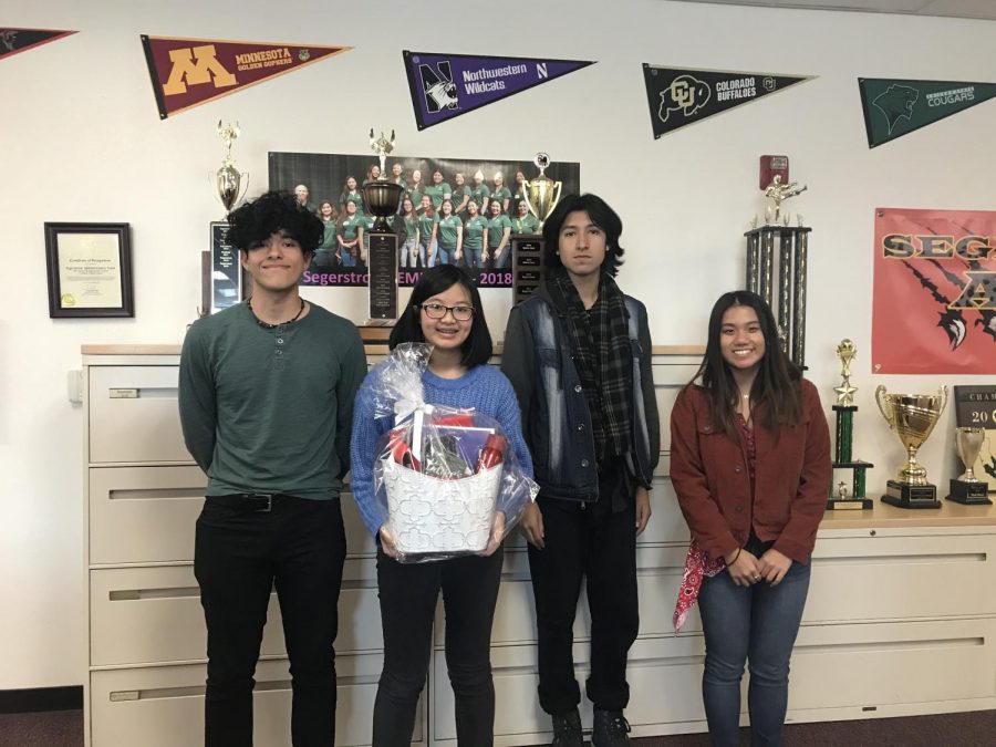 MIchelle Phan (10), Christie Vu (11), Saul Cervera (11), and Alberto Ramirez (11) stand together proudly after attending the celebratory luncheon. 