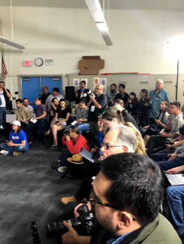 Photographers and journalists from various organizations at the Bernie press conference.