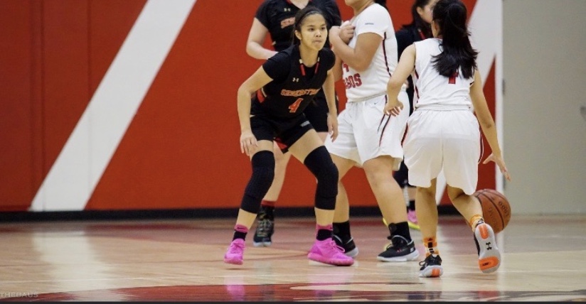 Emily Ngo (#4) in her black Segerstrom Gear guarding Westminster's point guard. 