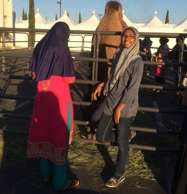 Sabira Mohammed attending an Islamic Society of Orange County (ISOC) event featuring a petting zoo.