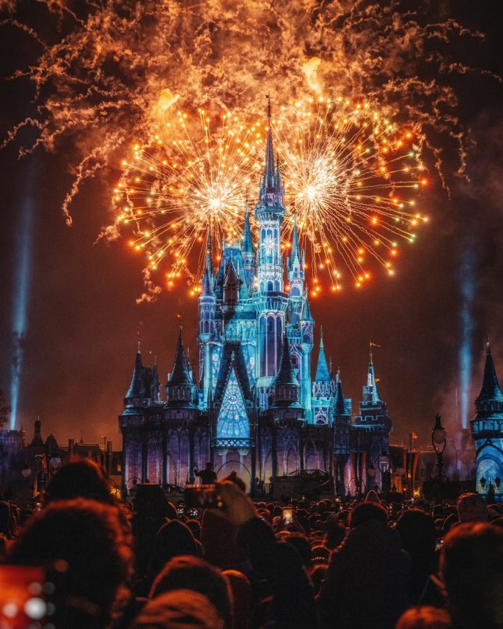 People enjoying the firework show that is surrounding the Disneyland castle. Photo Courtesy of: Zichuan Han from Pexels