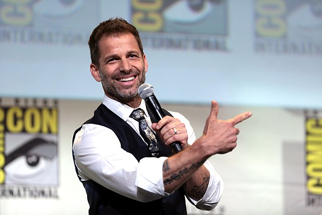 Zack Snyder speaking at the 2016 San Diego Comic Con International, for the original "Justice League," at the San Diego Convention Center in San Diego, California. Photo courtesy of: Gage Skidmore from Peoria, AZ, United States of America, CC BY-SA 2.0 , via Wikimedia Commons