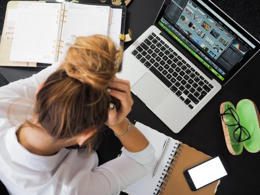 Having a job and attending virtual learning can be stressful (Photo Courtesy of: Pexels). 

