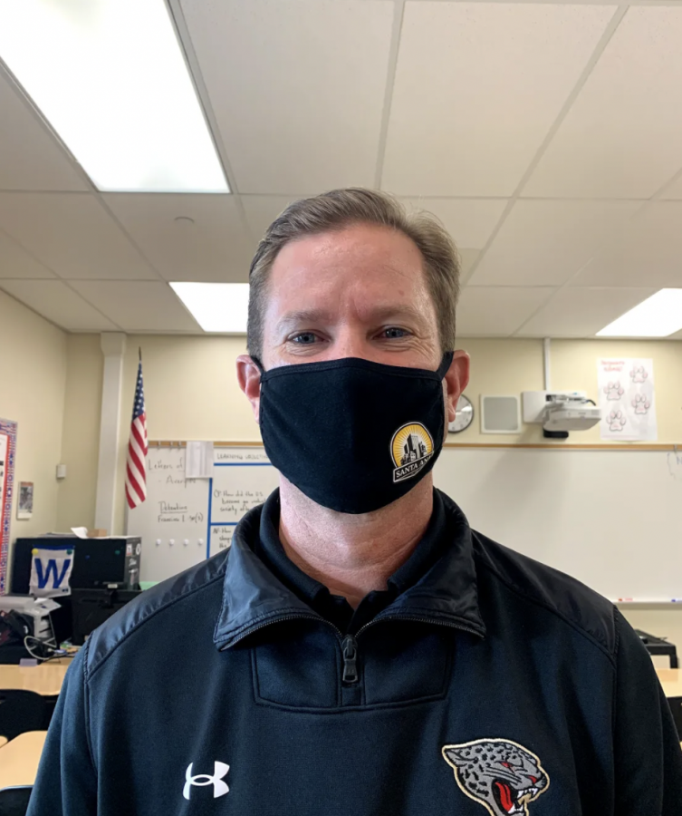 Mr. Bradshaw smiles underneath his mask after his fourth period just left for lunch.