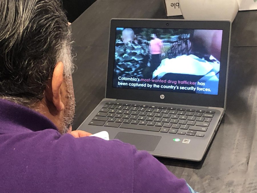 A man watches the Colombian drug lord news. (Image courtesy of Alondra Cifuentes)