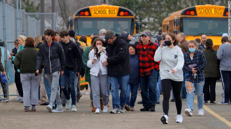 Students reconnect with their parents after experiencing the horrific event. (Image courtesy of CNN)