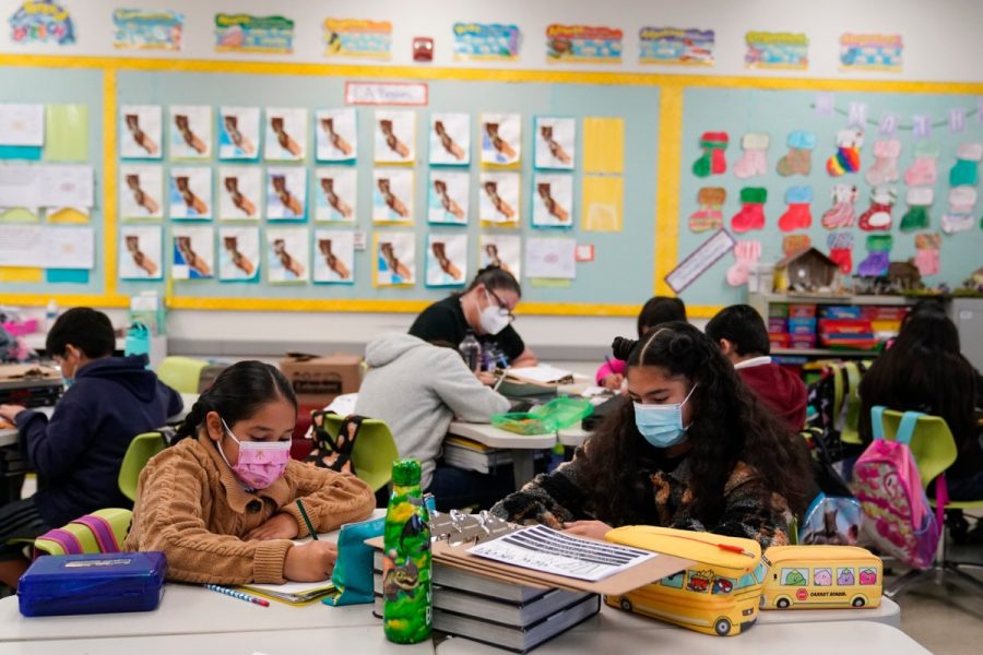 Fourth-grade students are wearing their masks while class is in session in Lynwood, California.