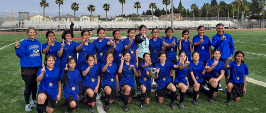 Mendez is celebrating their win at the girls soccer tournament after beating MacArthur, 1 to 0. 