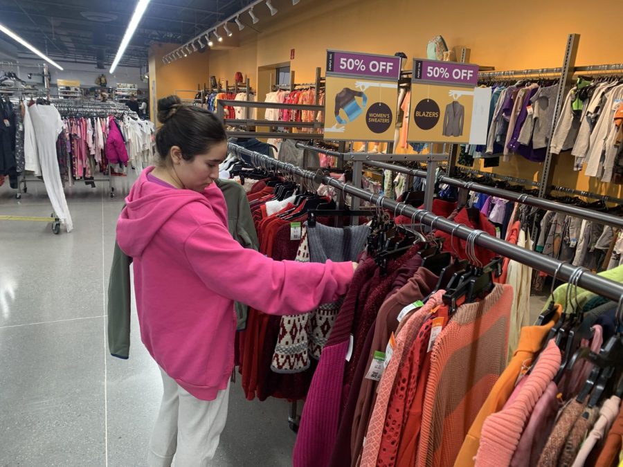 Avid thrifter Samantha Martinez browses through the clothing racks at Goodwill.