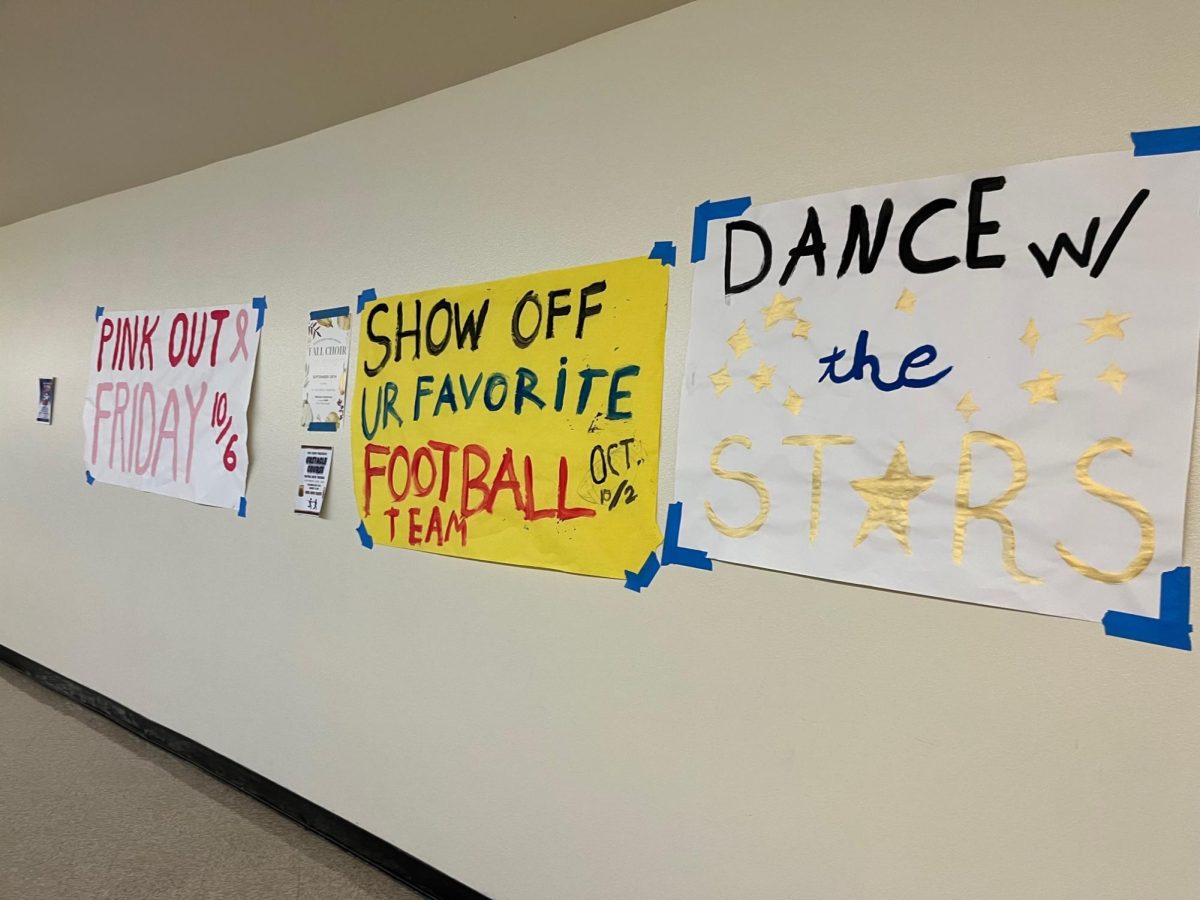 Homecoming posters line the walls of A Building, encouraging school spirit in the hallway.