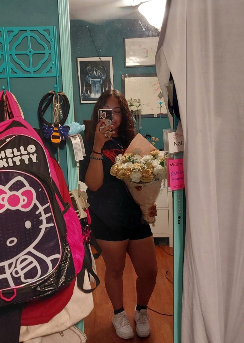 Natalie Ramos is a graduating senior this year, who is taking a selfie in her room.