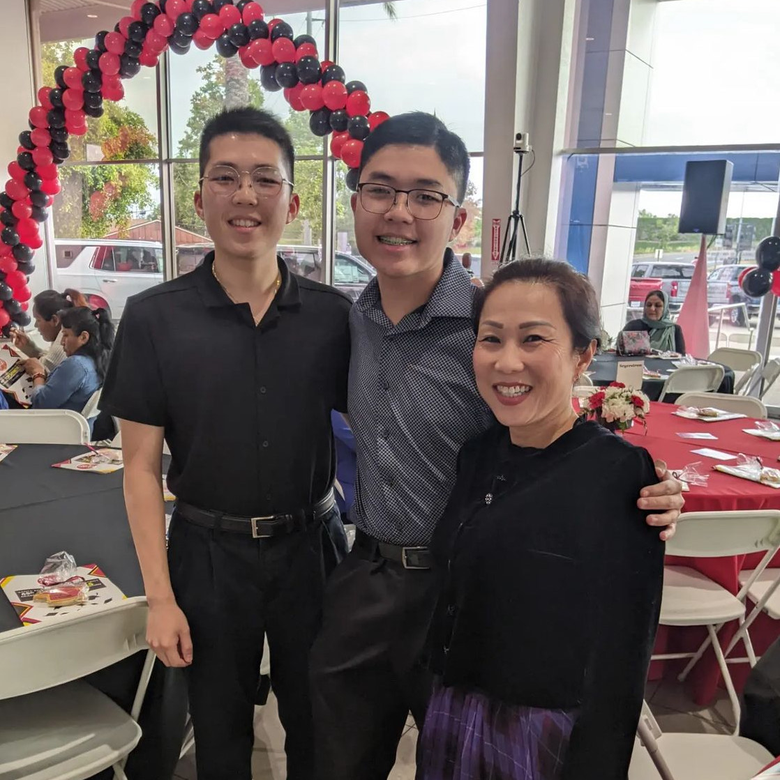 Joshua Vu attending the 100 Student Scholars at the district with his family.