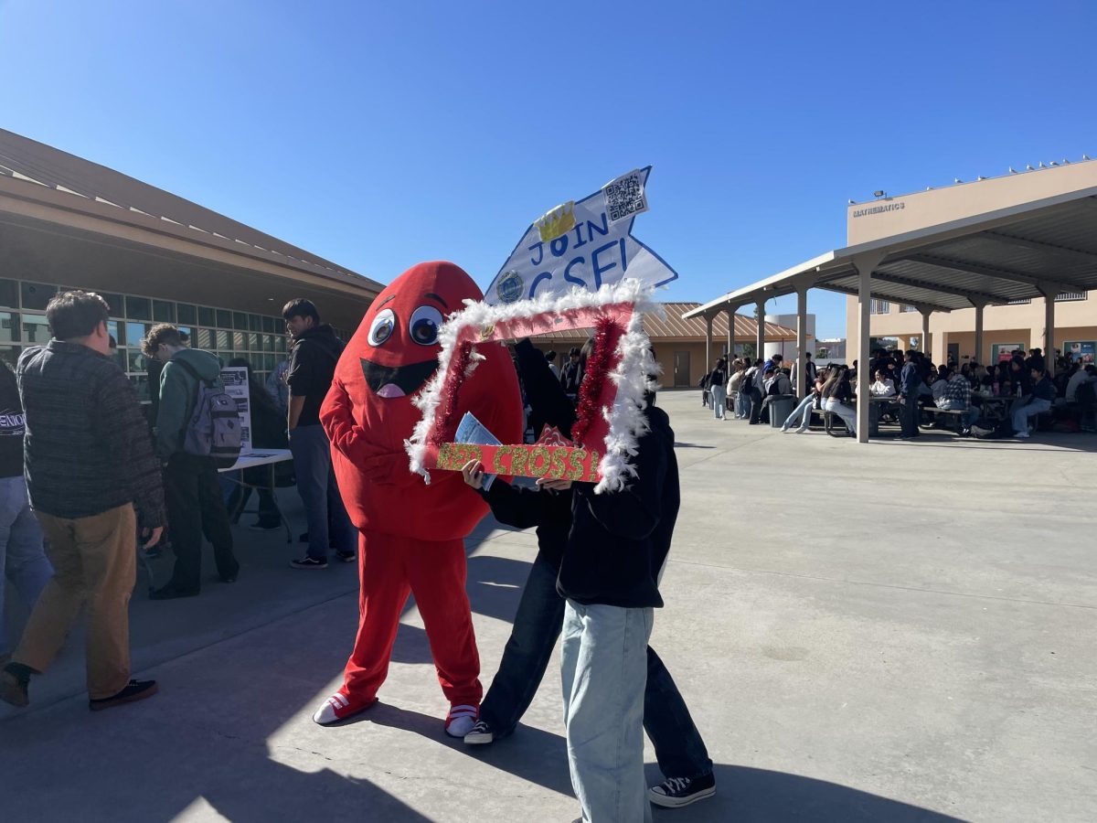 The Club Showcase promoted many different clubs to students with diverse interests. Here, we can see how Red Cross and CSF representatives get together to get their classmates excited about joining new clubs.