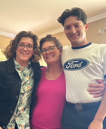 Jason Verde pictured smiling with his close ones. They are enjoying each other's company. 