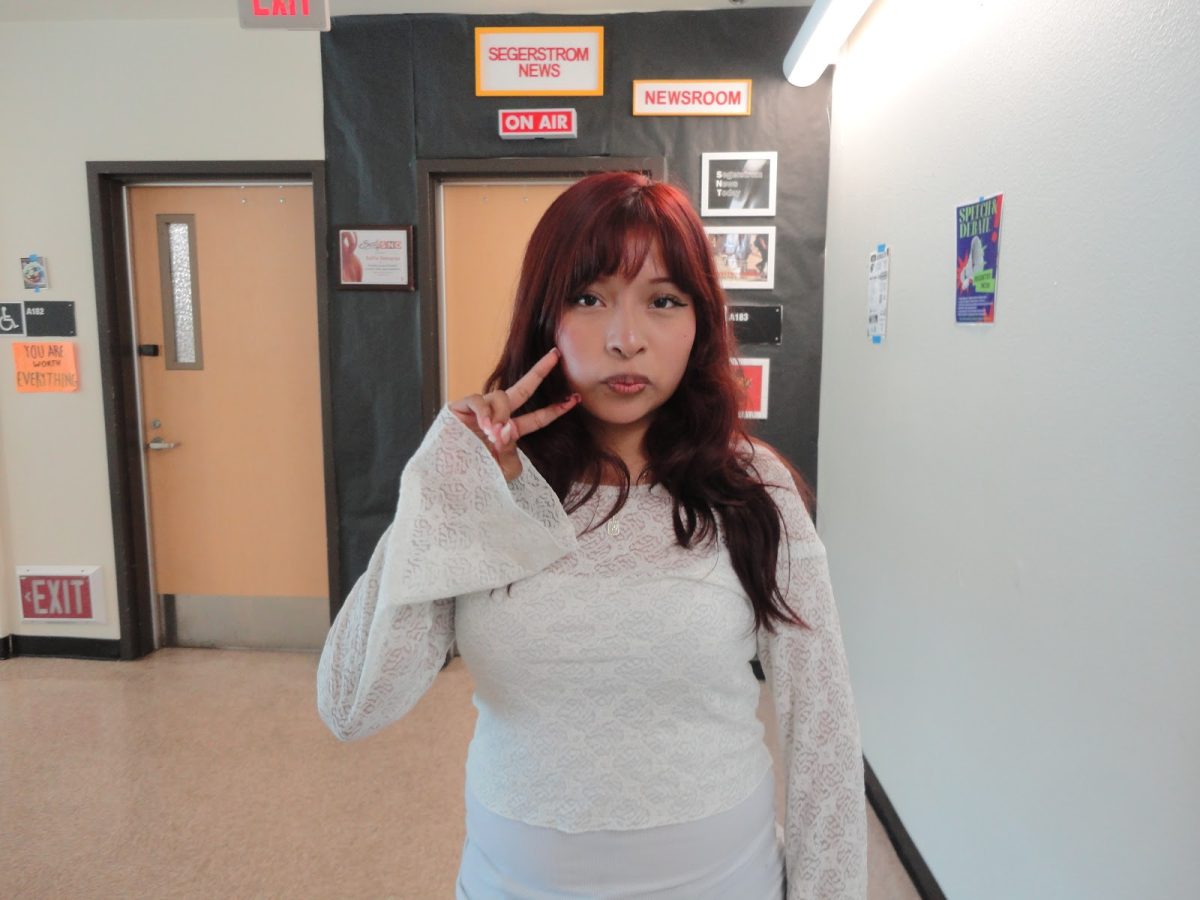 Featured is Kandy Cruz posing in front of the Segerstrom News classroom. She will most likely be on her way to film a WOTS episode. 
