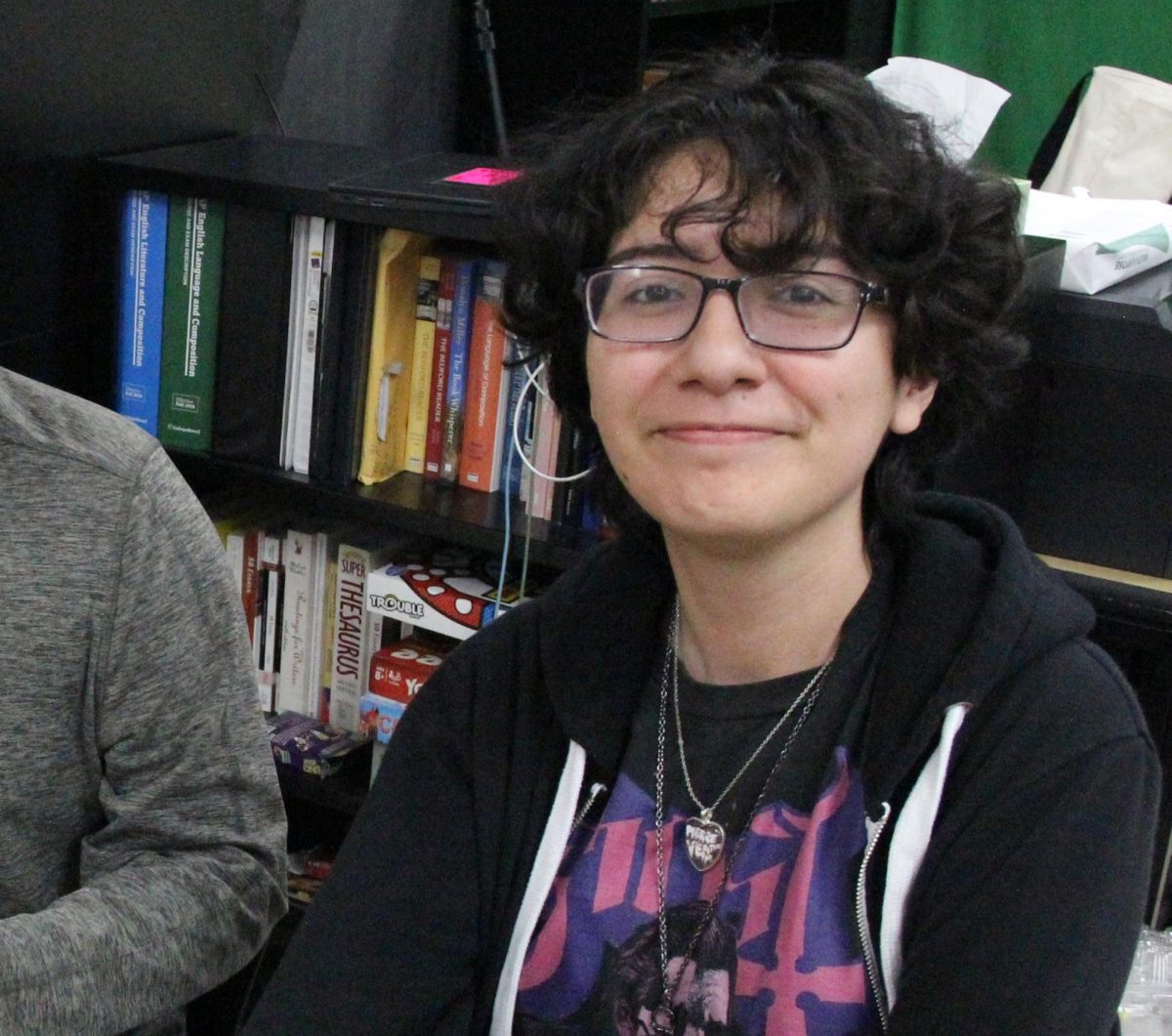 In the Segerstrom News classroom, Ximena smiles for the camera. She wrote many interesting stories for the news website.