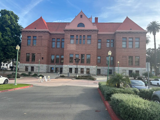 The photo highlights the Old Orange County Courthouse. This symbolizes one of the courthouses that Ryan Wedding may be prosecuted in.