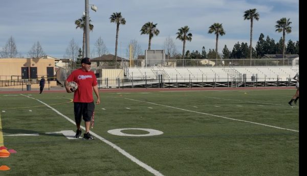 Coach Aguirre is depicted in this photo, coaching his team on their way to CIF. Coach A has put significant work into his team, the proof shown in the abilities of the athletes and them making it to CIF.