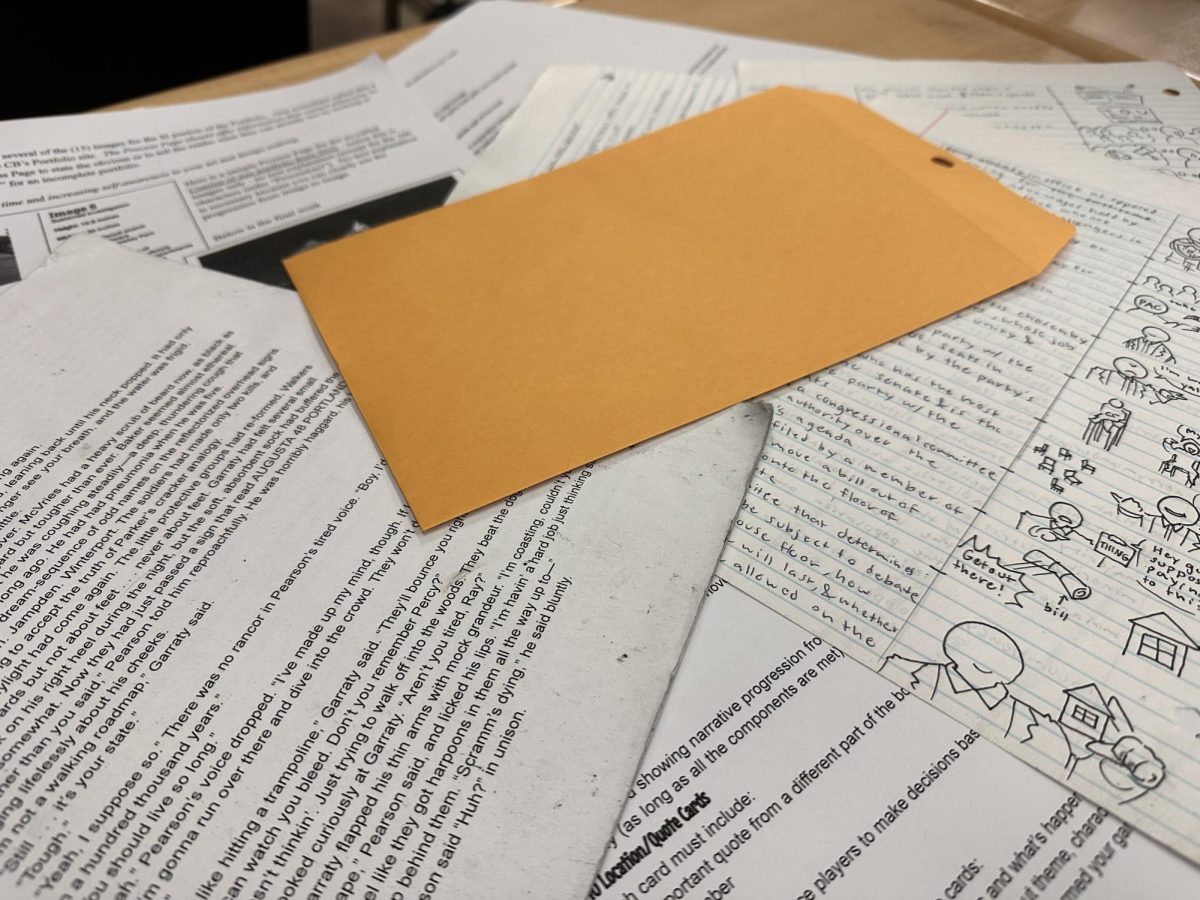 This photo illustrates an envelope over several stacks of paper. It highlights the release of the new Jeffery Epstein Files and the lawsuits arising as a result. 